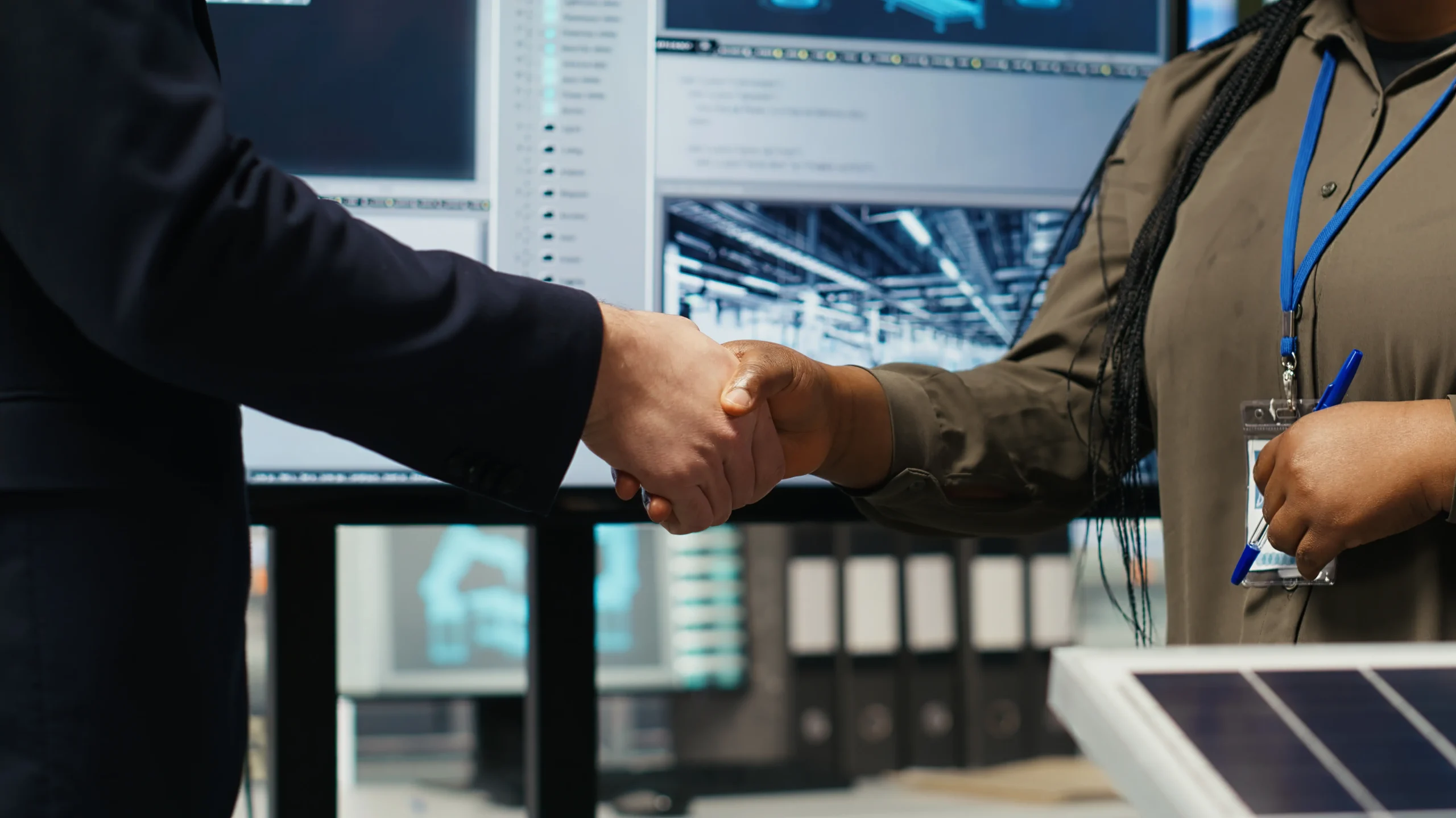investors-shaking-hands-closing-deal-after-reviewing-solar-technology-reports